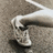 A static image shows a person's legs and feet on a textured surface with blue text reading "it is rude to count the people out loud. you pass".