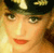 A 3x3 contact sheet of seven animated frames showing a woman with blonde hair, red lipstick, and a black cap with gold details in various facial expressions.