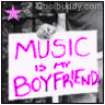 A black-and-white image with a pink star and text reading "MUSIC IS MY BOYFRIEND" on a white sign held by hands, transitioning from dark to light background.