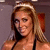 A woman with long blonde hair and a black halter top appears in two side-by-side frames showing slight head movement.