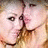 A pixelated animated icon shows a person with light skin and brown hair in two sequential poses, first facing left then turning right while holding hands near the face.