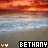 A pixelated sunset over water with two versions of the name 'BETHANY' in contrasting text styles and colors.