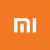 Orange square background with white stylized 'MI' logo featuring layered, pixelated outlines and a central vertical bar.