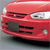 Red vehicle front view with headlights, grille, and visible license plate area on a gray background.