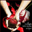 Two hands holding a red rose with a red ribbon, set against a dark background with blurred white flowers.