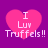 Four identical pink heart-shaped icons with white text "I Luv Truffels!!" on a purple background, arranged in a