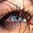 A pixelated close-up of a human eye with blue iris and brown eyelashes, split into four quadrants with text overlays on two sections.
