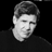 Static grayscale pixel art of a person's head and shoulders against black background with visible dithering and anti-aliasing on edges.