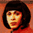 A pixelated image shows a person with dark hair against an orange background, next to the word "RENT" in white block letters on red.