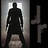 Pixelated silhouette of a figure in dark clothing standing in a doorway with light behind, next to a stylized 'T' symbol on black background.