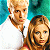 Pixelated image showing two people on left side with green text 'Original Icons .com' on right side against dark background.