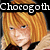 Pixelated image of a person with short blonde hair wearing a brown hat and dark clothing, with partial text above reading "Chorogoth".