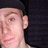 A person wearing a black cap and dark clothing appears in four with slight variations in head position and background elements