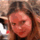A woman with long brown hair appears in three showing slight head movements and changing facial expressions against a blurred background