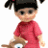 Pixelated image of a child with black hair in pigtails wearing a red short-sleeve shirt and holding a brown object.