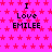 A static image with a bright pink background covered in small red stars, displaying repeated text "I Love EMILEE" in black pixelated font.