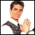 Pixelated static image of a person in business attire with one arm raised, set against a plain white background.