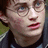 Pixelated image of a person with round glasses on the left, next to bright green with orange text reading "Hottie!!!" and "I LOVE YOU!!!" on a gray background