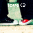 Pixelated image of a character's lower body with green pants, white shoes, and red accents on the feet against a dark background.