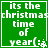 Green square with white pixelated text reading 'its the christmas time of year(:', featuring a small snowflake symbol at bottom right.
