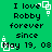 Green background with black text reading "I love Robby forever since May 19, 08" and white pixelated square-and-dot patterns scattered across the image.