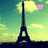 Animated Eiffel Tower icon with pink heart and yellow clouds against greenish sky, showing subtle cloud movement.