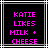 Black background with white and gray lines, pink pixelated text reading KATIE LIKES MILK + CHEESE in four lines