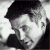 Black-and-white pixelated static image of a person's face with dark hair and facial features rendered in grayscale tones, appearing as an AOL Instant Messenger buddy icon.