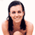 Static pixelated image of a person with long dark hair wearing a sleeveless top, smiling against a white background.
