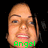 Pixelated close-up of a person's face with light skin, brown eyebrows, and visible teeth; green text reading 'Angel' at the bottom.