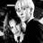 Pixelated black-and-white image of a person with light hair holding an object, next to pixelated text reading SECRET LOOVE <33 on a dark background.