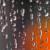 Pixelated static image with dark upper section and orange-red lower section, featuring scattered white and light gray pixels against a predominantly dark background.