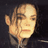A pixelated image of Michael Jackson with green text on a black background, part of an animated contact sheet frame showing multiple frames of the same design.