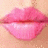 A split image shows a realistic pink lip close-up on the left and a pixelated purple kiss mark with white heart center on the right.