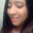 Pixelated close-up of a person with long dark hair against a light background, showing partial facial features and a neutral expression.
