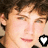 four identical pixelated images of a person with brown hair, each featuring a black and white heart-and-LL symbol overlay