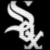 Pixelated white stylized 'S' shape on black background with small detached pixel cluster above.