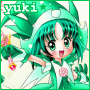 Green-haired anime character with large eyes and pink cheeks, wearing a green and white outfit with a pink circular emblem, holding a pink flower-like object.