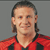 Static pixelated image of a person in red and black sports jersey against gray background, likely a historical digital avatar icon.