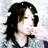 A pixelated image of a person with dark hair and light clothing, next to green text on a dark blue background.
