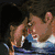 Two figures in close embrace with one figure resting head on shoulder, followed by a blue glowing text 'twilight' on dark background.
