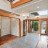 Pixelated static image of an interior space with wooden trim, a window with greenery outside, and light-colored walls.