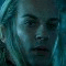 A split-screen image shows a character with long light hair and a serious expression, with text labels 'Haldir', 'of', and 'Lorien' in glowing light blue font on dark backgrounds.