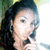 Pixelated close-up of a person with dark hair, light skin tone, and visible ear showing partial facial features against blurred background.