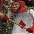 A pixelated contact sheet showing two frames of an animated icon featuring a character in red and white attire holding a stick, next to green text reading "Original Icons .com" on a dark background.
