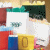 A 2x2 contact sheet of a pixelated animated icon showing four distinct frames with colorful objects, text, and a heart symbol on pastel backgrounds.