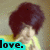 Pixelated image of a person with dark brown hair and light skin, wearing a yellow garment, with a cyan text box displaying 'love.'