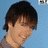 Pixelated image of a person with dark hair against light blue background, next to green text on black background.