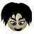 Pixelated face with black hair, squinted eyes, and a small smile on a gray background.