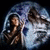 Pixelated image of a person with long dark hair in a dark outfit, seated against a light blue and white background with a circular frame.